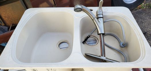 Beige double granite sink. 33" x 22" outside measurements.