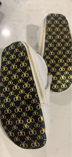White Slip-On Sneakers with Black and Gold Monogram Sole