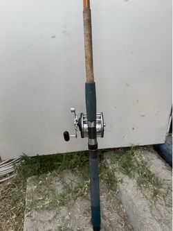 Vintage Sabre golden 6-1/2 ft rod and Penn conventional Reel