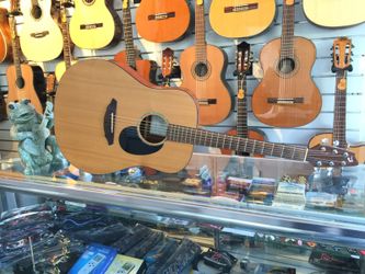 Slightly Used Acoustic Guitar With Padded Bag