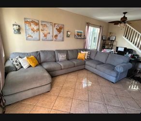 Beautiful Grey Sectional couch from Jerome’s
