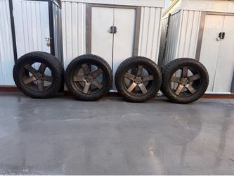 Rims for sale with tires.