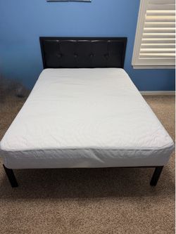 Full-size bed with 10 inch mattress in a new condition