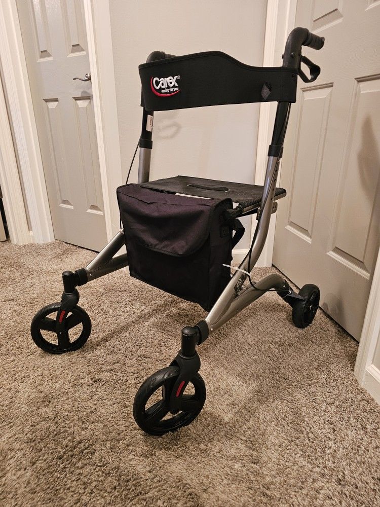 Nice Carex Crosstour Rolling Walker with locking brakes & storage bag. Soft contouring back rest.
