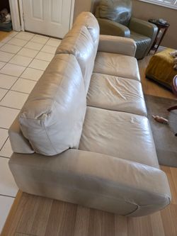 Natuzzi leather couch, love seat, chair and ottoman.