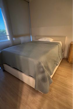 Bed frame with storage drawer