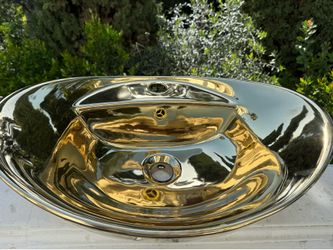 Gold sink measuring 15 inches by 24 inches