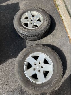 2 jeep wrangler wheels an tires
