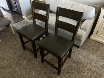 Brown chairs barstools (two)