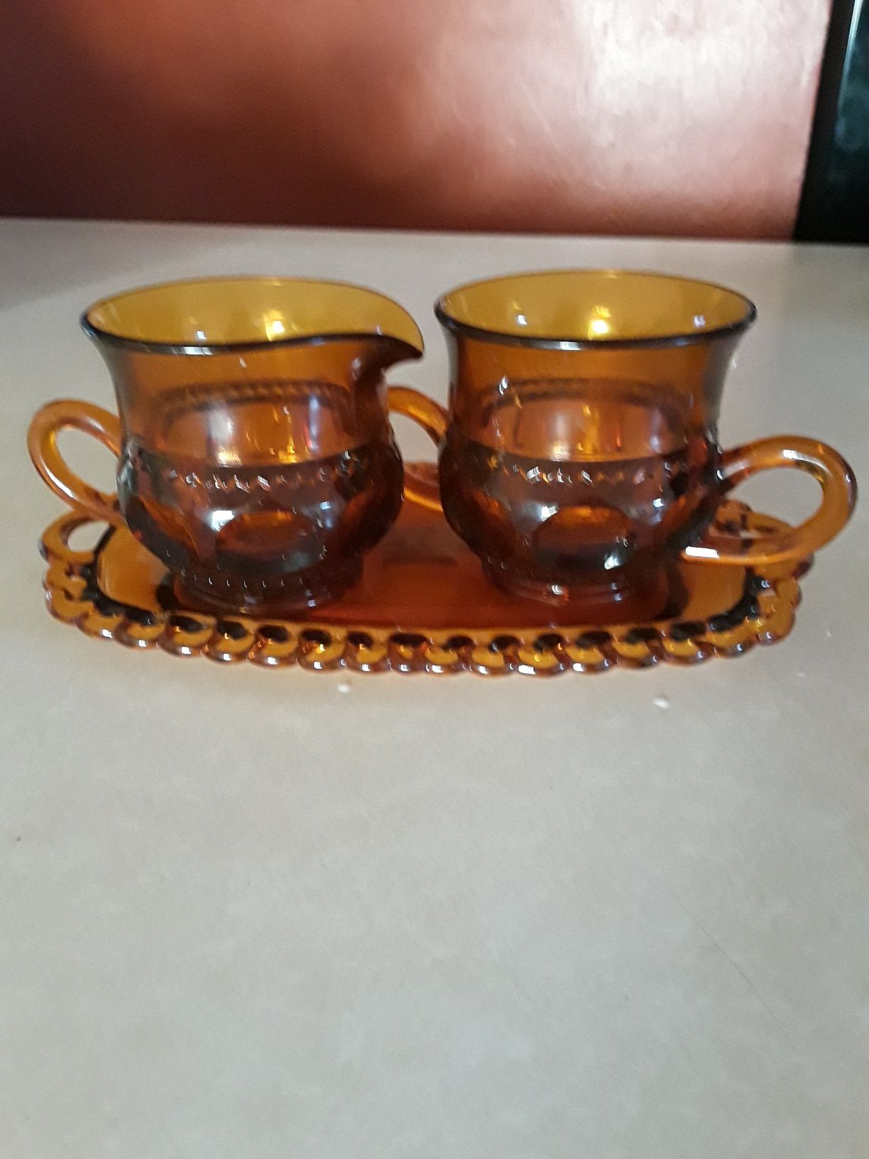 Indiana Glass KINGS CROWN Pattern Amber Sugar and Creamer Set on Glass Tray