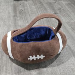 Halloween Football Plush Trick or Treat Bucket. Dimensions: 15" L x 10" W x 7"H

