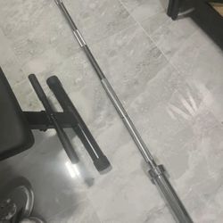 New Never Used Olympic 7 Foot Barbell Bar Have Also Curl Bar And 45s New Additional Price 