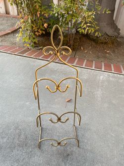 Vintage gold metal scrollwork towel or magazine rack