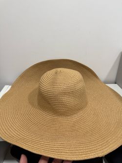 Large tan floppy sun hat