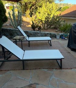 Two white lounge chairs