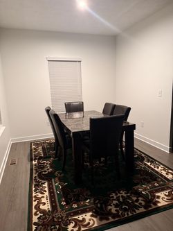 Dining table, including chairs.