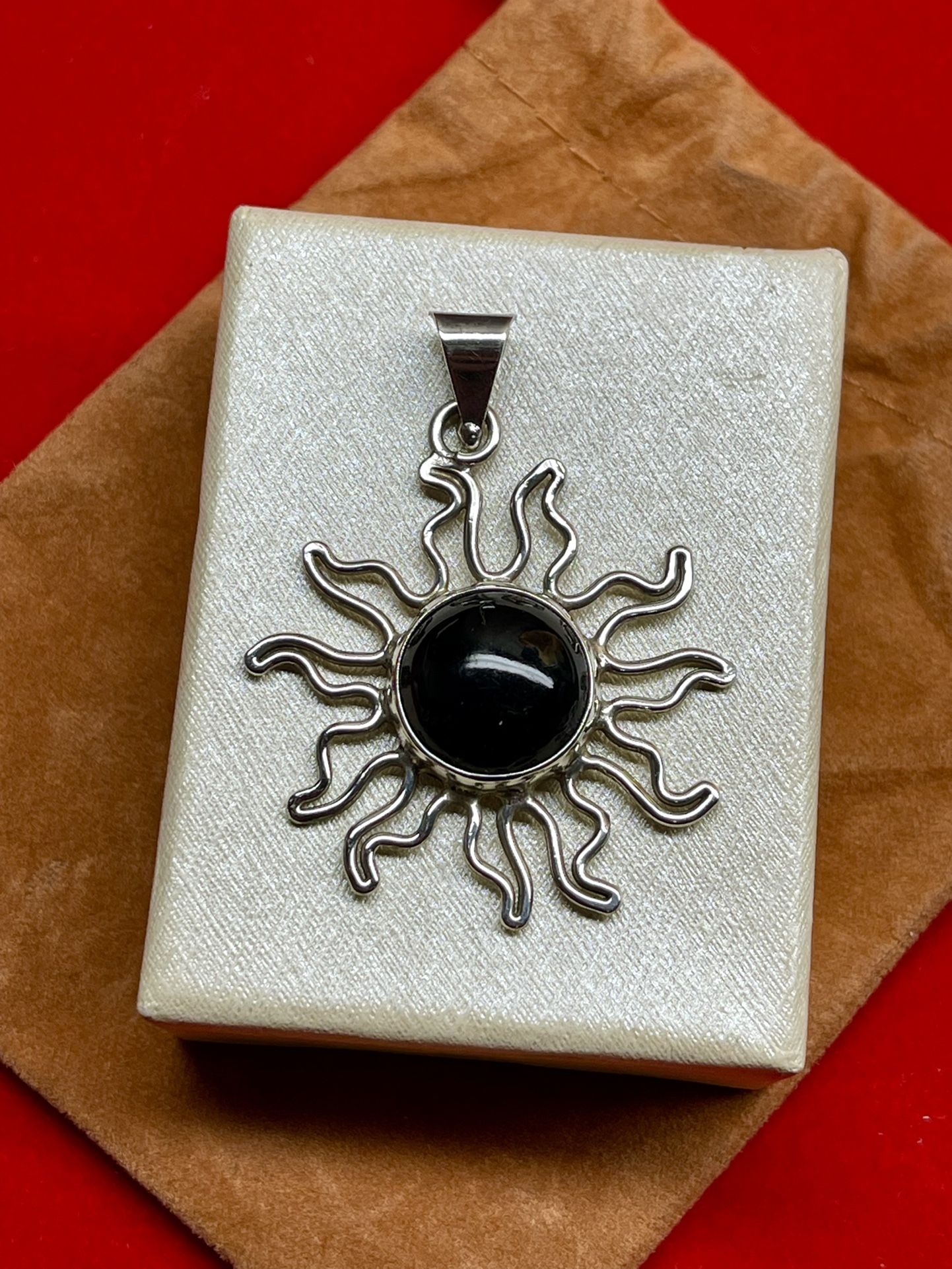 STERLING SILVER ONYX SUN PENDANT