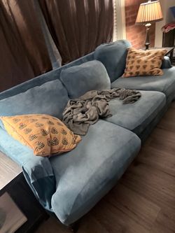 Tan couch with blue cover