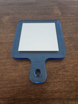 Blue hand mirror
