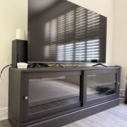 Black/ Dark brown TV stand with sliding glass doors