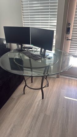 Glass top wrought iron table