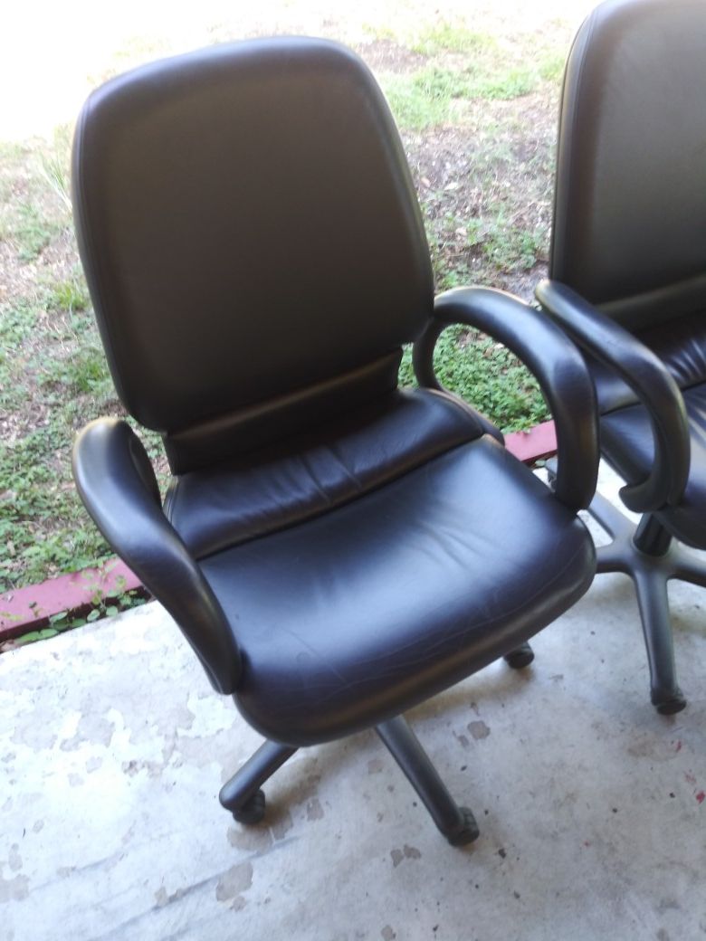 TWO MATCHING ADJUSTABLE LEATHER OFFICE CHAIRS