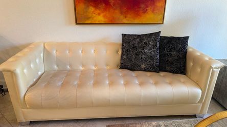 White Tufted Leather Sofa and matching armchair