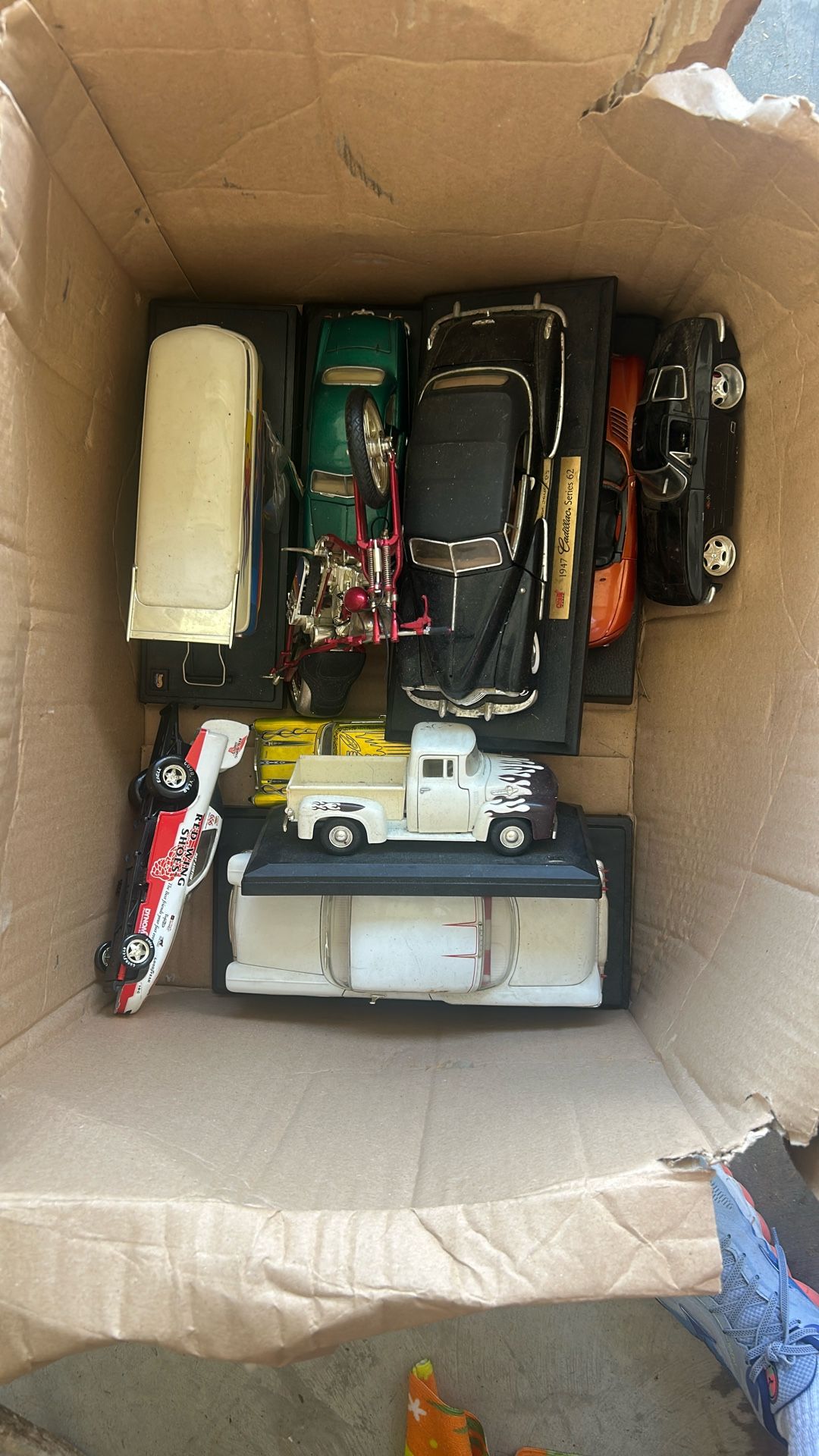 box of vintage model cars