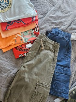 7 piece bundle. 5 tops and 2 shorts all withing the L and XL kids clothes. Perfect for 8 to 10 yr old.