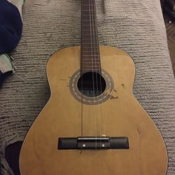 Nice vintage guitar needs two strings only $50 firm
