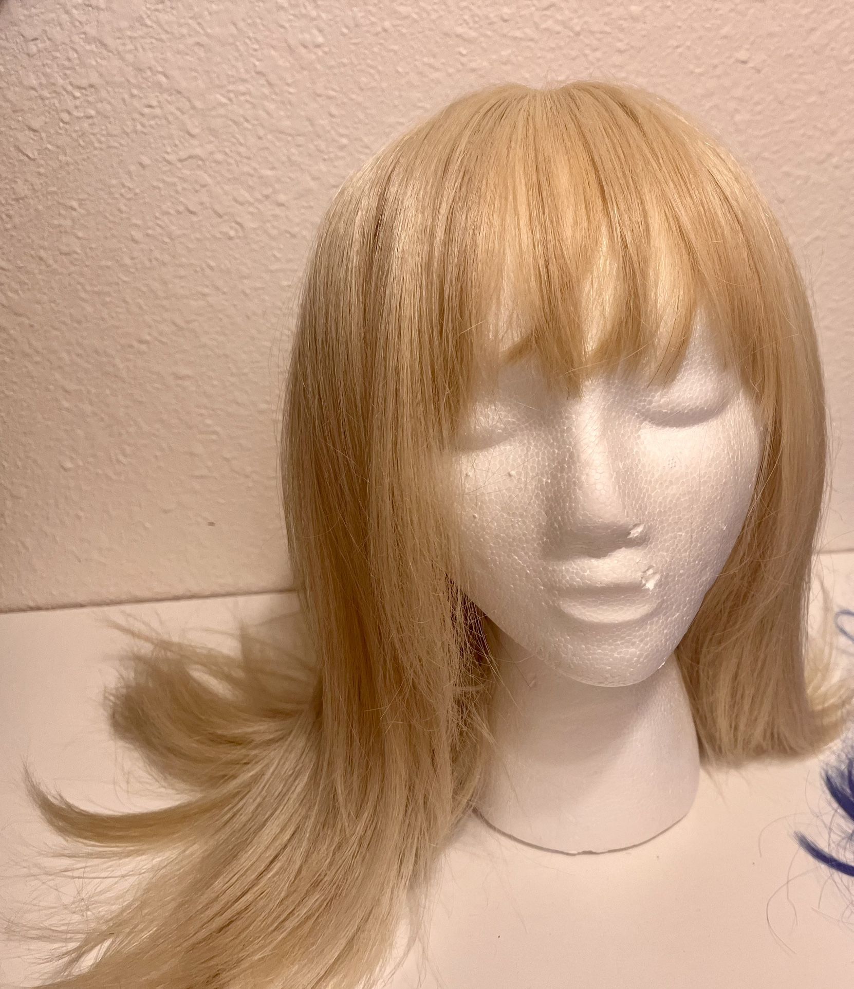 Women’s Wigs and styrofoam wig heads.