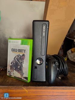 Xbox 360 slim console with controller and game
