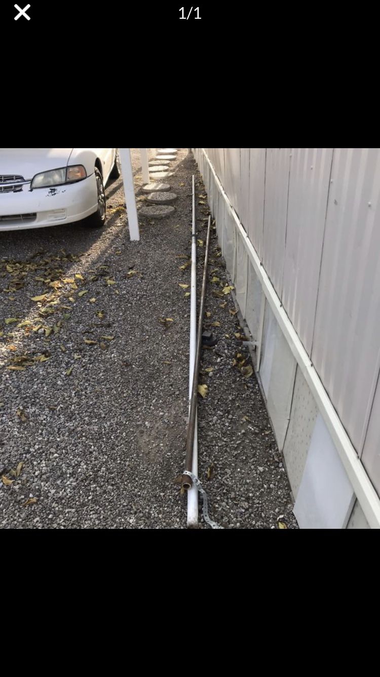 2 Metal Antenna Poles 1 Approximately 12’ another 20’ ft long