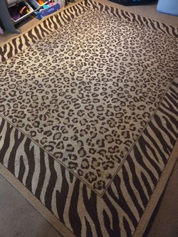 FREE animal print rug, very heavy, needs cleaning