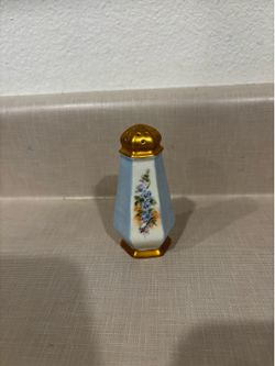 Cute vintage salt shaker with flowers running down every other side