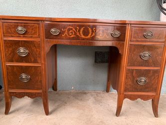 Kivintage mid-20th century mahogany kneehole vanity desk with burl drawer fronts and marquetry inlay.