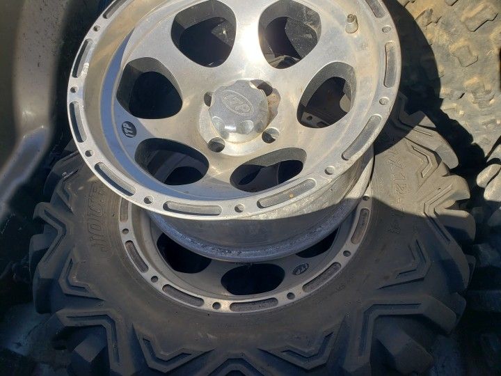Itp Wheels And 27x12-14 Tires