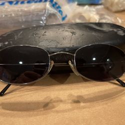 Vintage Georgio Armani sunglasses. Sunglasses are in excellent condition. The case is old and worn, 