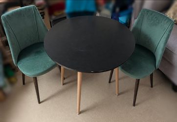 Black Dining Table with 2 green velvet dining chairs