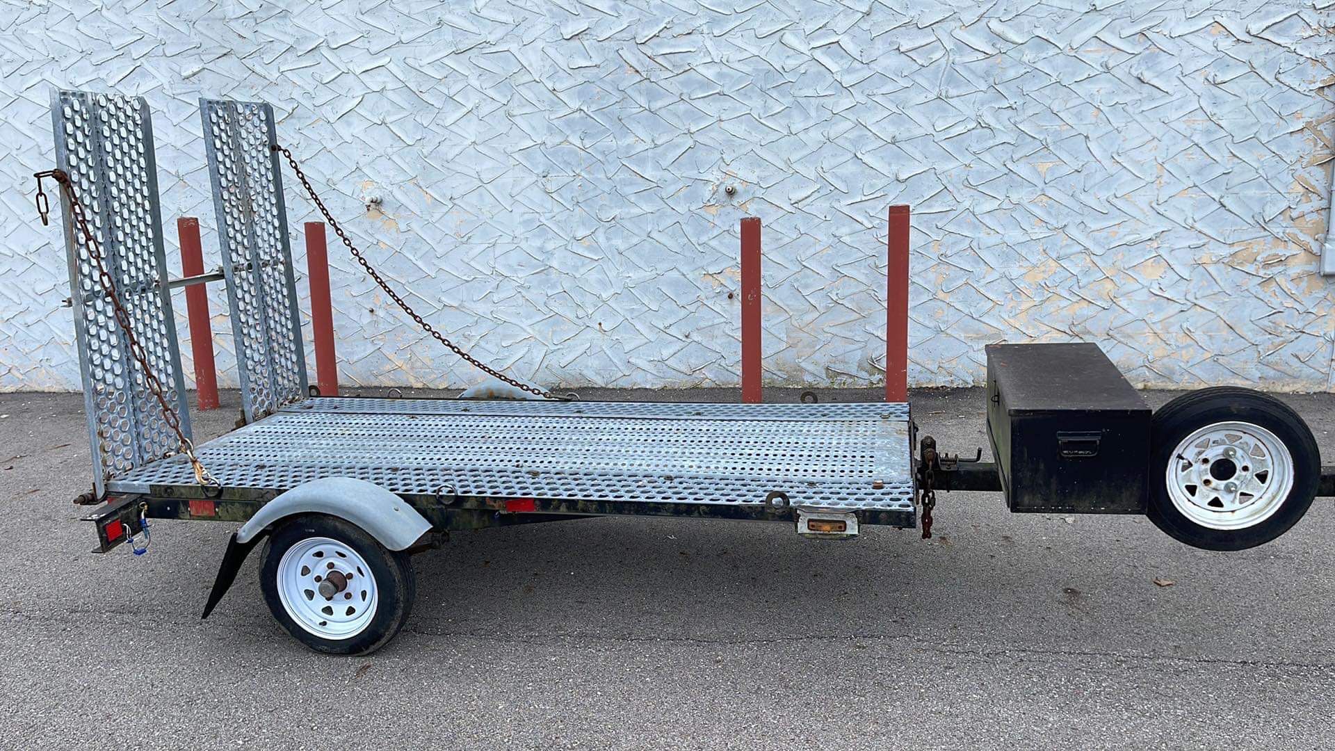 Trailer 8.8 x 4 ft with tool box and car ramps.