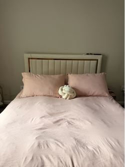 Cream Upholstered Queen Bed with Gold Trim