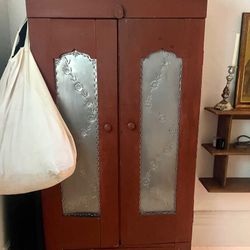 Gorgeous Red Cabinet With Lower Drawer And Hooks