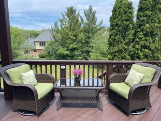 Patio Swivel Chairs And A Table