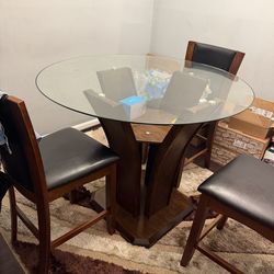 Round brown wood dining table set