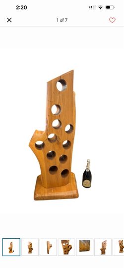 hand-carved from a single piece of organic, live-edge teak wood root. Standing an impressive 45" H x 17" x 14"