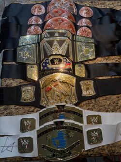 9 WWE Championship belts. Plastic.