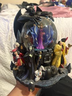 Disney villains snow globe