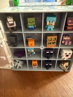Minecraft mini figures, keychains and collectors case.