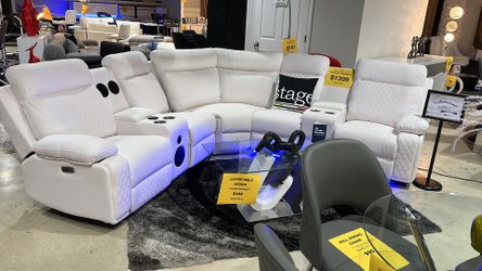 Sectional with 2 recliners, speaker Bluetooth and led light . Floor sample 1399