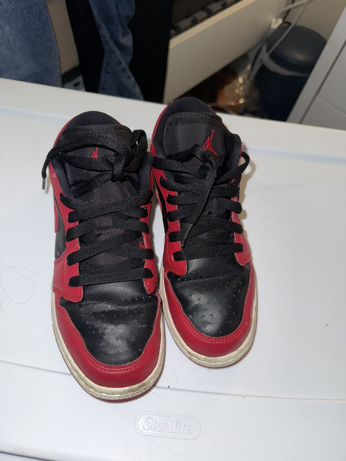 red and black nike low 